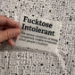 Bügelbild Fucktose Intolerant klein in Schwarz, ca. 10 x 6,5 cm, in der Hand gehalten