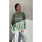 Bügelbild Plant Love Sukkulenten in Weiß auf einem grünen Sweatshirt (Beispielbild)