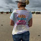 Frau am Strand von hinten im Batikshirt mit Plotterdatei „Less Drama More Sunrises"