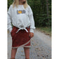 Schnittmuster Shabby Skirt Kids – rostroter Melange-Sweat im asymmetrischen Lagenlook mit cremefarbener Häkelspitze am Saum und seitlicher Eingrifftasche, dazu hellgrauer Sweater mit Plotter-Print „Kürbisliebe“
