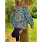 Schnittmuster Talia – türkise Tunika mit Matroschka- und Blumen-Print und langen Ärmeln mit Gummibündchen