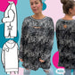 Cut Out Kleid – Titelbild Langarm-Version: Damen-Oversized-Kleid mit Cut-Out, dazu technische Zeichnungen mit Stern-Ärmel und Herz-Ausschnitt am Rücken, Gr. 34–52